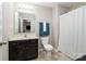 Bathroom with vanity, toilet and shower with shower curtain; simple and functional space at 887 Pointe Andrews Dr, Concord, NC 28025