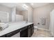 Bathroom featuring a long vanity and decorative finishes at 887 Pointe Andrews Dr, Concord, NC 28025