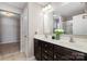 Bathroom featuring a double sink vanity and closet; perfect for getting ready in the morning at 887 Pointe Andrews Dr, Concord, NC 28025