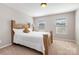 Bedroom features large windows and natural light; a peaceful retreat for rest at 887 Pointe Andrews Dr, Concord, NC 28025