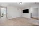 Bonus room with wall-mounted television; perfect space for fun and relaxation at 887 Pointe Andrews Dr, Concord, NC 28025