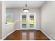 Dining area features hardwood floors and french doors to outside at 887 Pointe Andrews Dr, Concord, NC 28025