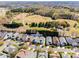 Aerial view showcases homes on Platinum Dr surrounded by green space and trees at 974 Platinum Dr, Fort Mill, SC 29708