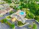 Aerial view of the community clubhouse with a pool, tennis courts, and well-manicured landscaping at 974 Platinum Dr, Fort Mill, SC 29708