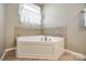 Garden tub with tile surround at 974 Platinum Dr, Fort Mill, SC 29708