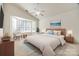 Relax in this bedroom with neutral colors and a ceiling fan at 974 Platinum Dr, Fort Mill, SC 29708