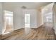 Bright hallway featuring beautiful laminate floors and access to bathroom, bedroom and living areas at 974 Platinum Dr, Fort Mill, SC 29708