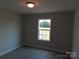 Comfortable bedroom with wood-look floors and a view of a yard at 122 Mason Tanner Ct # 5, Rock Hill, SC 29730