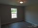 Bright bedroom with wood-look floors and a view of a yard at 122 Mason Tanner Ct # 5, Rock Hill, SC 29730