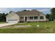 Charming single-story home featuring a welcoming front porch and attached garage at 122 Mason Tanner Ct # 5, Rock Hill, SC 29730