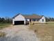 Under-construction home featuring a front porch, open garage, and situated on a spacious lot at 122 Mason Tanner Ct # 5, Rock Hill, SC 29730