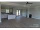 Open-concept kitchen features an island with granite countertops, modern appliances, and abundant natural light at 122 Mason Tanner Ct # 5, Rock Hill, SC 29730