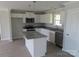 Modern kitchen boasts granite countertops, white cabinets, and stainless-steel appliances at 122 Mason Tanner Ct # 5, Rock Hill, SC 29730
