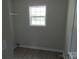 Laundry room with wood-look flooring, window, and wire shelving at 122 Mason Tanner Ct # 5, Rock Hill, SC 29730