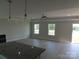 Bright living room area with multiple windows and a ceiling fan at 122 Mason Tanner Ct # 5, Rock Hill, SC 29730