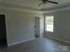 Spacious main bedroom featuring a tray ceiling, ceiling fan, and windows at 122 Mason Tanner Ct # 5, Rock Hill, SC 29730