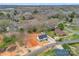 An aerial view captures a newly built home, situated on a lot with ample space, complemented by mature trees at 1313 Gidney St, Shelby, NC 28150