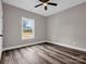 Bright bedroom with wood-look floors, ample natural light, and minimalist design elements creating a cozy retreat at 1313 Gidney St, Shelby, NC 28150