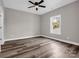 Neutral bedroom features a ceiling fan, closet, a window to provide ample natural light and new flooring at 1313 Gidney St, Shelby, NC 28150