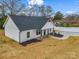 Charming new construction shows off its welcoming front porch and modern curb appeal in this sunny exterior shot at 1313 Gidney St, Shelby, NC 28150