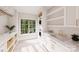 Well-lit laundry room with modern washer and dryer, marble countertops, and ample storage space at 20310 Havenview Dr, Cornelius, NC 28031