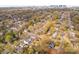 Aerial view of a residential neighborhood with lush greenery and the city skyline in the background at 2508 Bay St, Charlotte, NC 28205