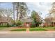 Charming brick home with dormer windows surrounded by mature trees and landscaping at 2508 Bay St, Charlotte, NC 28205