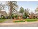 Charming brick home with dormer windows, complemented by lush greenery and mature trees at 2508 Bay St, Charlotte, NC 28205