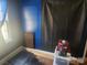 Bedroom with blue walls, a window and a brick vent at 316 Reese St, Gastonia, NC 28056