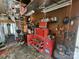 Spacious garage with tool storage, workbench, and exposed insulation in ceiling at 316 Reese St, Gastonia, NC 28056