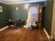 Living room with hardwood floors, white Christmas tree and furniture at 316 Reese St, Gastonia, NC 28056