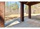 Back porch area with brick columns and view of the expansive backyard at 3334 Cloninger Rd, Dallas, NC 28034