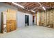 Spacious unfinished basement featuring exposed beams, insulation, and concrete flooring at 3334 Cloninger Rd, Dallas, NC 28034