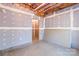 View of an unfinished basement showing exposed ceiling, drywall, and a doorway at 3334 Cloninger Rd, Dallas, NC 28034