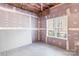 Unfinished basement space with drywall and a window bringing natural light into the space at 3334 Cloninger Rd, Dallas, NC 28034