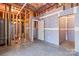 Unfinished basement with wood frame walls, doorway, and exposed ceiling at 3334 Cloninger Rd, Dallas, NC 28034