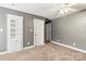 Comfortable bedroom featuring neutral carpet, built-in shelving, and ceiling fan with lighting at 3334 Cloninger Rd, Dallas, NC 28034