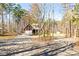 View of brick home, long driveway, and landscaping at 3334 Cloninger Rd, Dallas, NC 28034