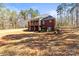 Rear exterior of a two story brick home surrounded by trees at 3334 Cloninger Rd, Dallas, NC 28034