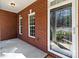 Home entry featuring sidelight windows, brick, and lighting at 3334 Cloninger Rd, Dallas, NC 28034