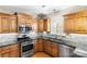 Kitchen area boasting stainless steel appliances and granite countertops at 3334 Cloninger Rd, Dallas, NC 28034