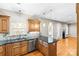 Bright kitchen with stainless steel appliances and tiled backsplash adjacent to the living room at 3334 Cloninger Rd, Dallas, NC 28034