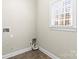 A utility room that features a window, utility hookups, and tiled flooring at 3334 Cloninger Rd, Dallas, NC 28034