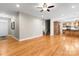 View of the open-concept living room with wood floors and stairs at 3334 Cloninger Rd, Dallas, NC 28034