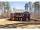 Brick home with a screened porch and backyard at 3334 Cloninger Rd, Dallas, NC 28034