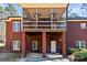 Screened-in back porch with ceiling fans and brick exterior, perfect for outdoor enjoyment at 3334 Cloninger Rd, Dallas, NC 28034