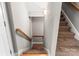 Carpeted stairway with wooden handrail leading to the upper level, enhanced by overhead lighting at 3334 Cloninger Rd, Dallas, NC 28034