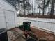 Enclosed backyard area with white fence, convenient for waste disposal and yard maintenance at 5650 Kimmerly Woods Dr, Charlotte, NC 28215