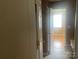 Bathroom doorway with a partial view of the sink and toilet at 5650 Kimmerly Woods Dr, Charlotte, NC 28215