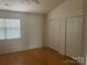 Bright bedroom with hardwood floors and dual closets at 5650 Kimmerly Woods Dr, Charlotte, NC 28215